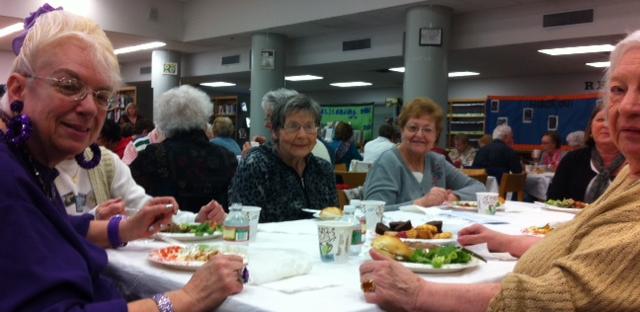 Eileen Sacca (center) enjoys lunch with friends after North's play.